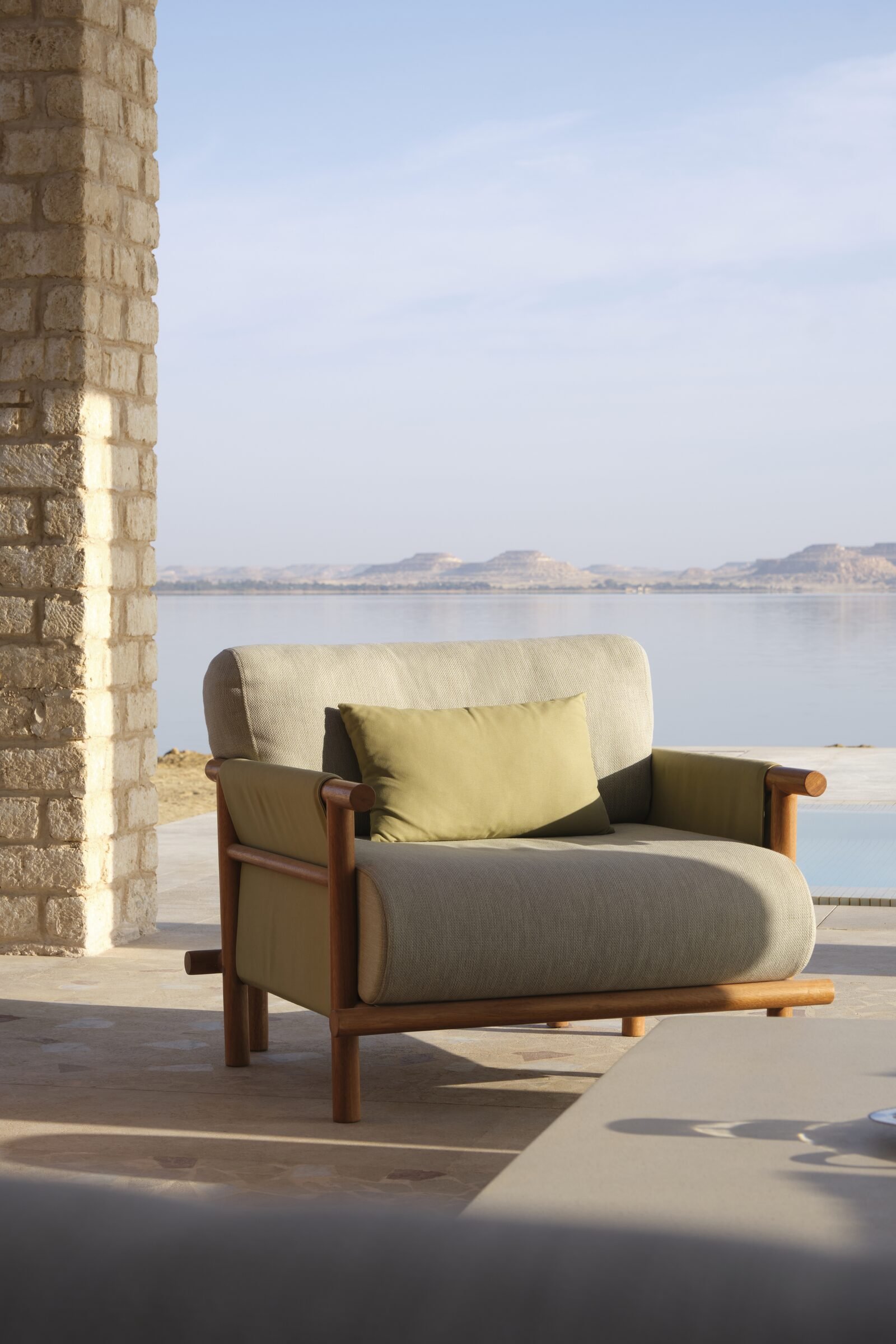A lounge chair at the water's edge on Lake Siwa