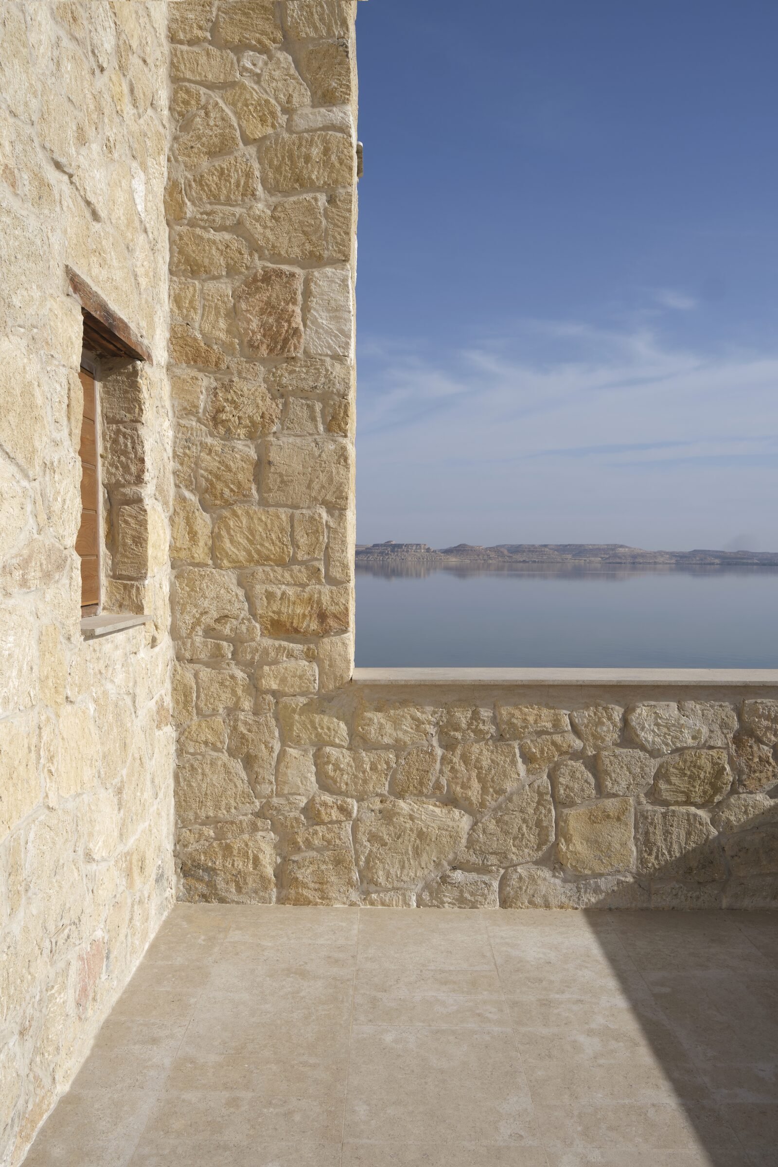 The mirror surface of Lake Siwa at dawn
